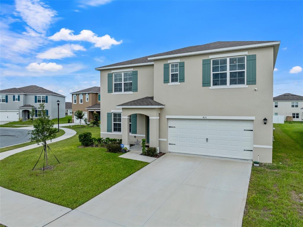 821 Sun Burst Road Winter Haven, FL 33880 - Photo 4 of 86 a front view of house with yard and green space