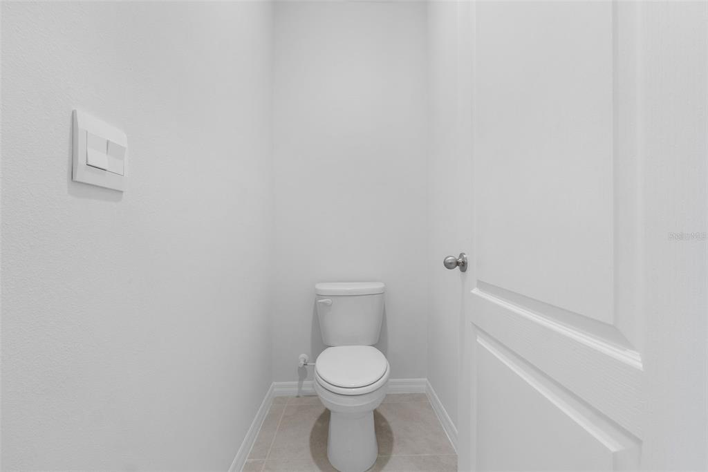 821 Sun Burst Road Winter Haven, FL 33880 - Photo 46 of 86 a white toilet sitting next to a white cabinet