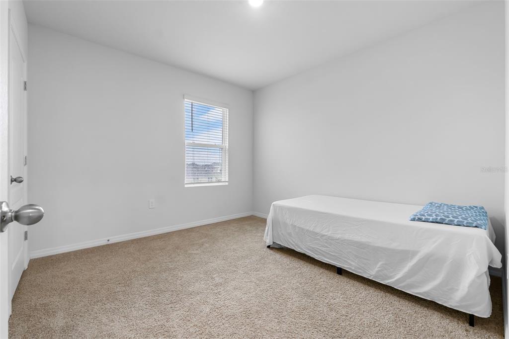821 Sun Burst Road Winter Haven, FL 33880 - Photo 50 of 86 a bedroom with a bed and a window