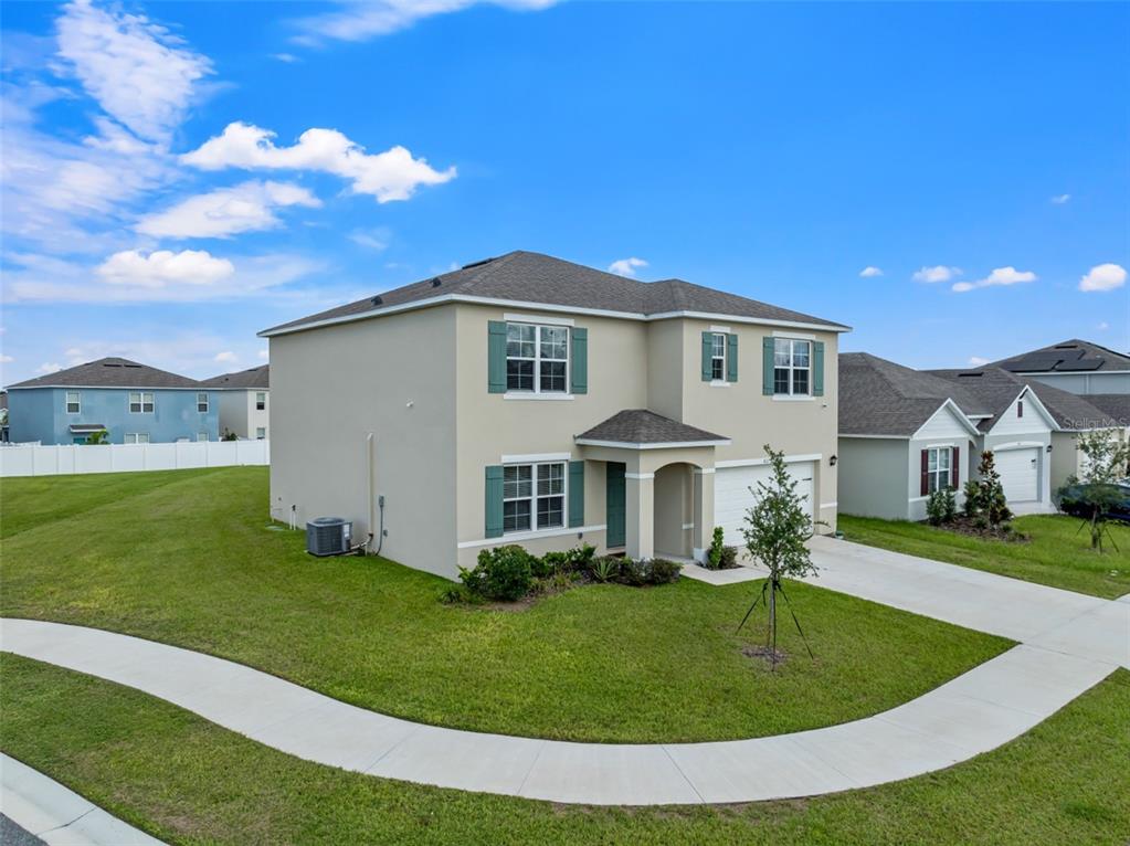 821 Sun Burst Road Winter Haven, FL 33880 - Photo 5 of 86 a front view of a house with a yard