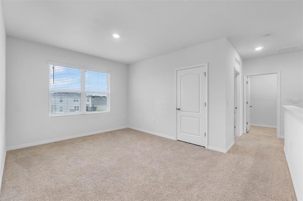 821 Sun Burst Road Winter Haven, FL 33880 - Photo 54 of 86 a view of an empty room with a window