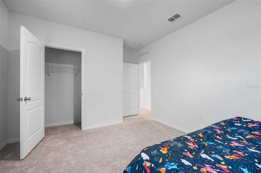 821 Sun Burst Road Winter Haven, FL 33880 - Photo 56 of 86 a bedroom with a bed and a dresser