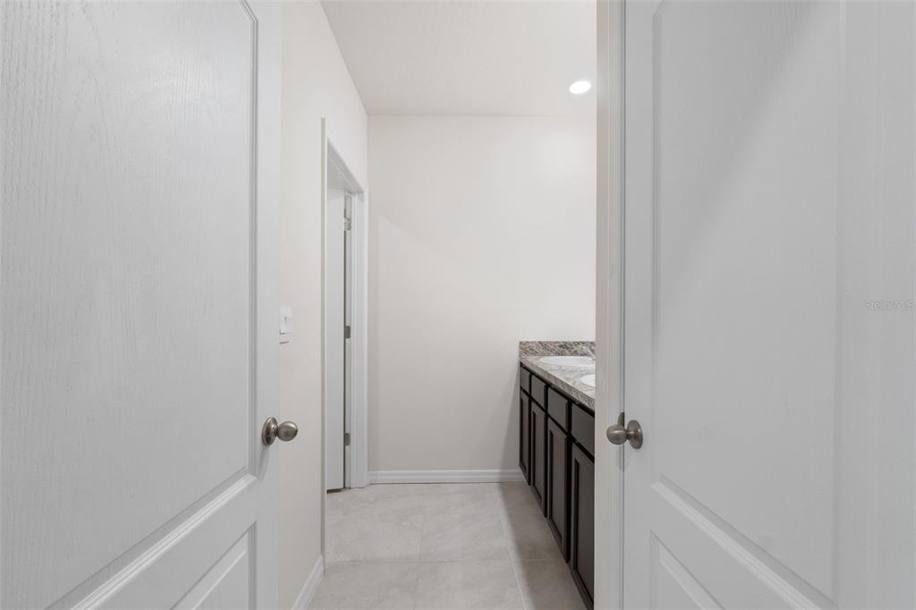 821 Sun Burst Road Winter Haven, FL 33880 - Photo 59 of 86 a bathroom with a sink a washer and dryer