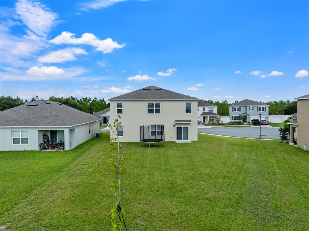 821 Sun Burst Road Winter Haven, FL 33880 - Photo 70 of 86 a view of a house with a big yard