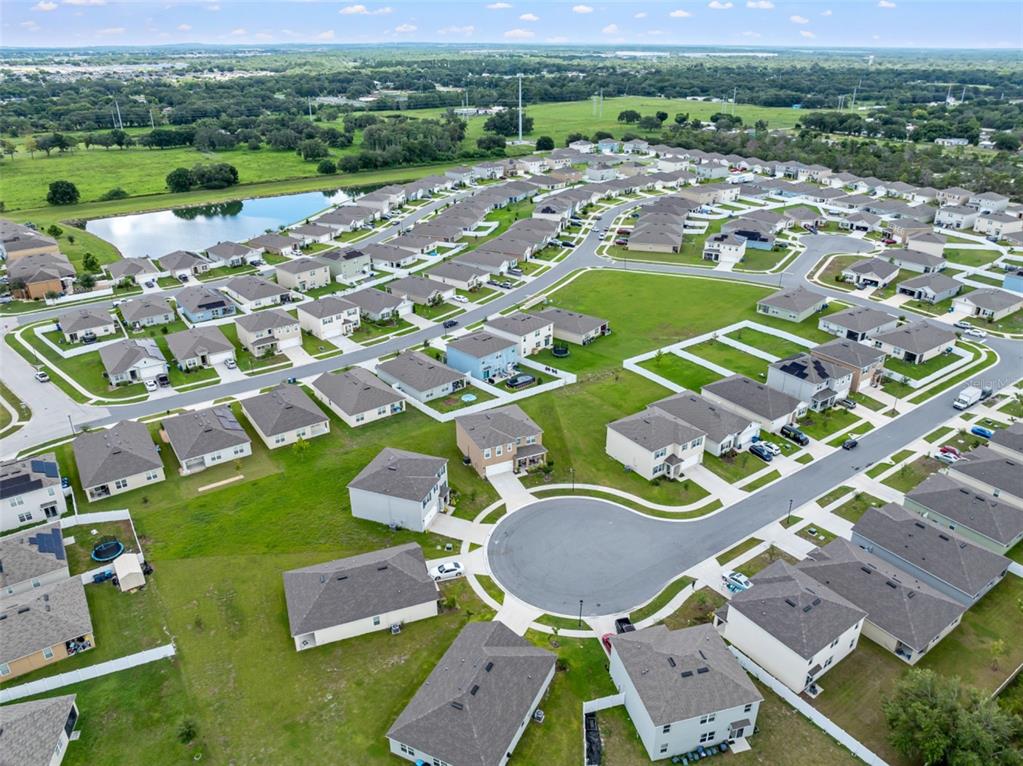 821 Sun Burst Road Winter Haven, FL 33880 - Photo 81 of 86 an aerial view of residential houses with outdoor space and river