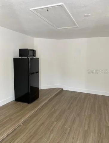 a room with a sink cabinets and utility