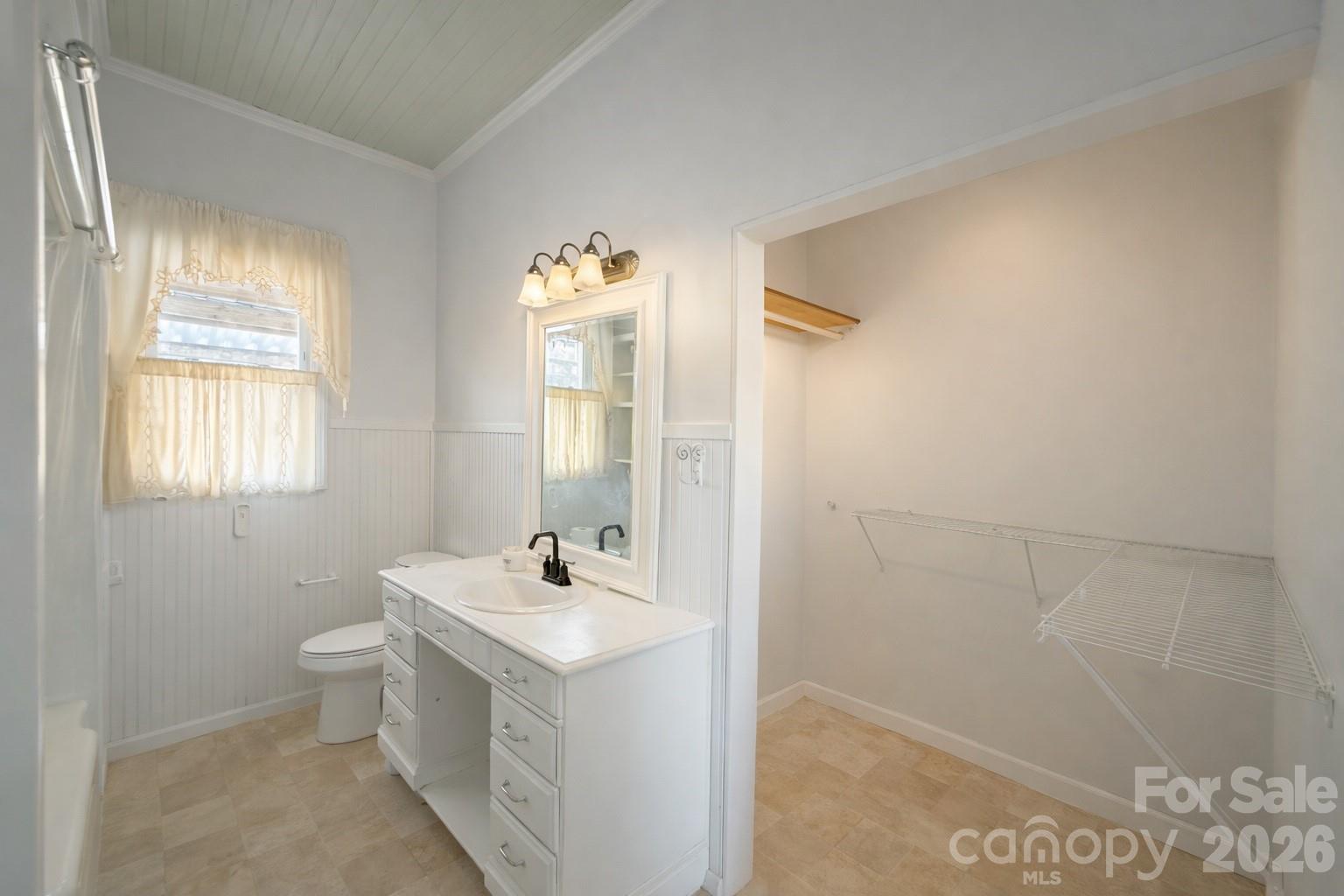 129 11th Street Spencer, NC 28159 - Photo 11 of 22 a bathroom with a sink a toilet and shower