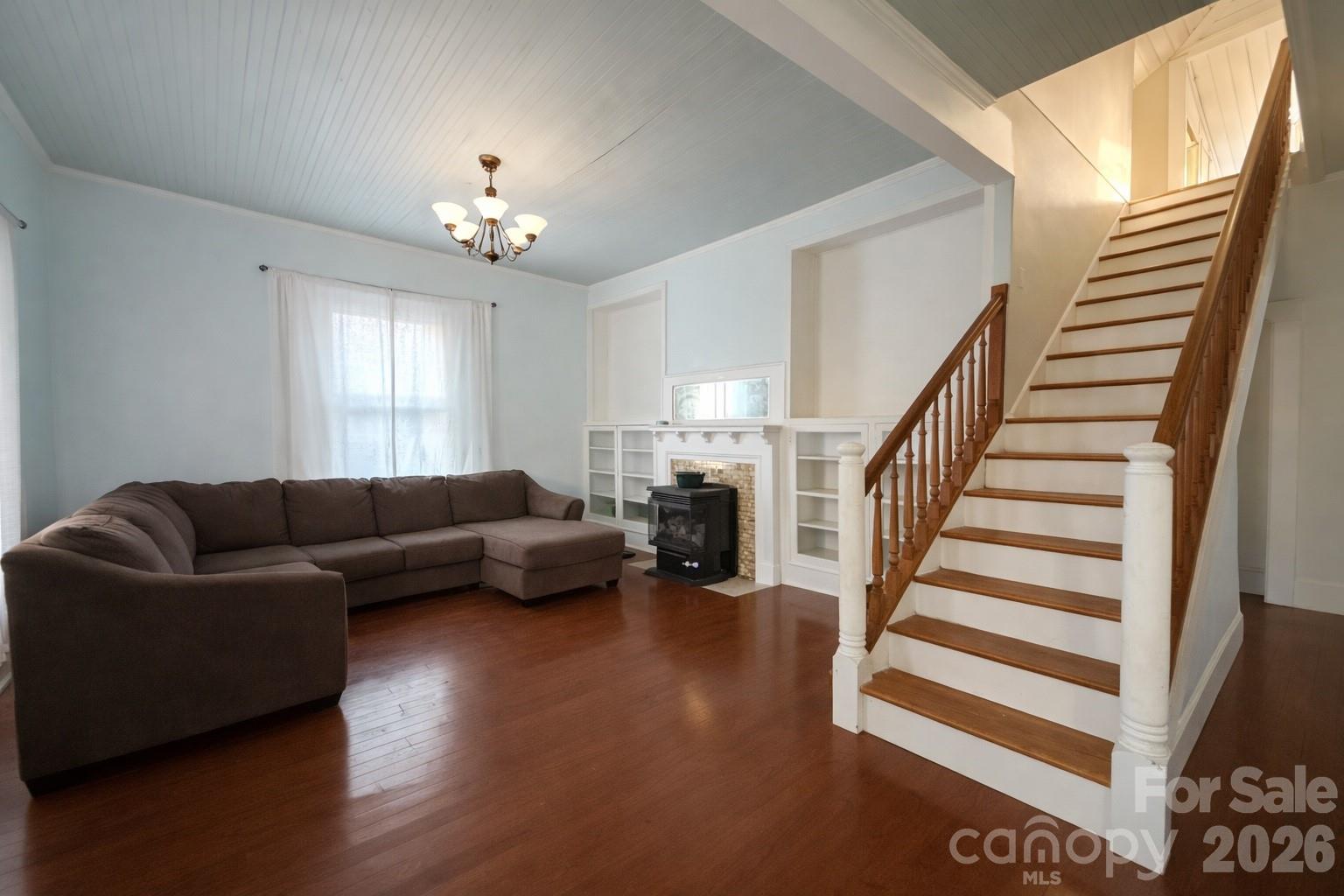 129 11th Street Spencer, NC 28159 - Photo 14 of 22 a living room with furniture and a chandelier