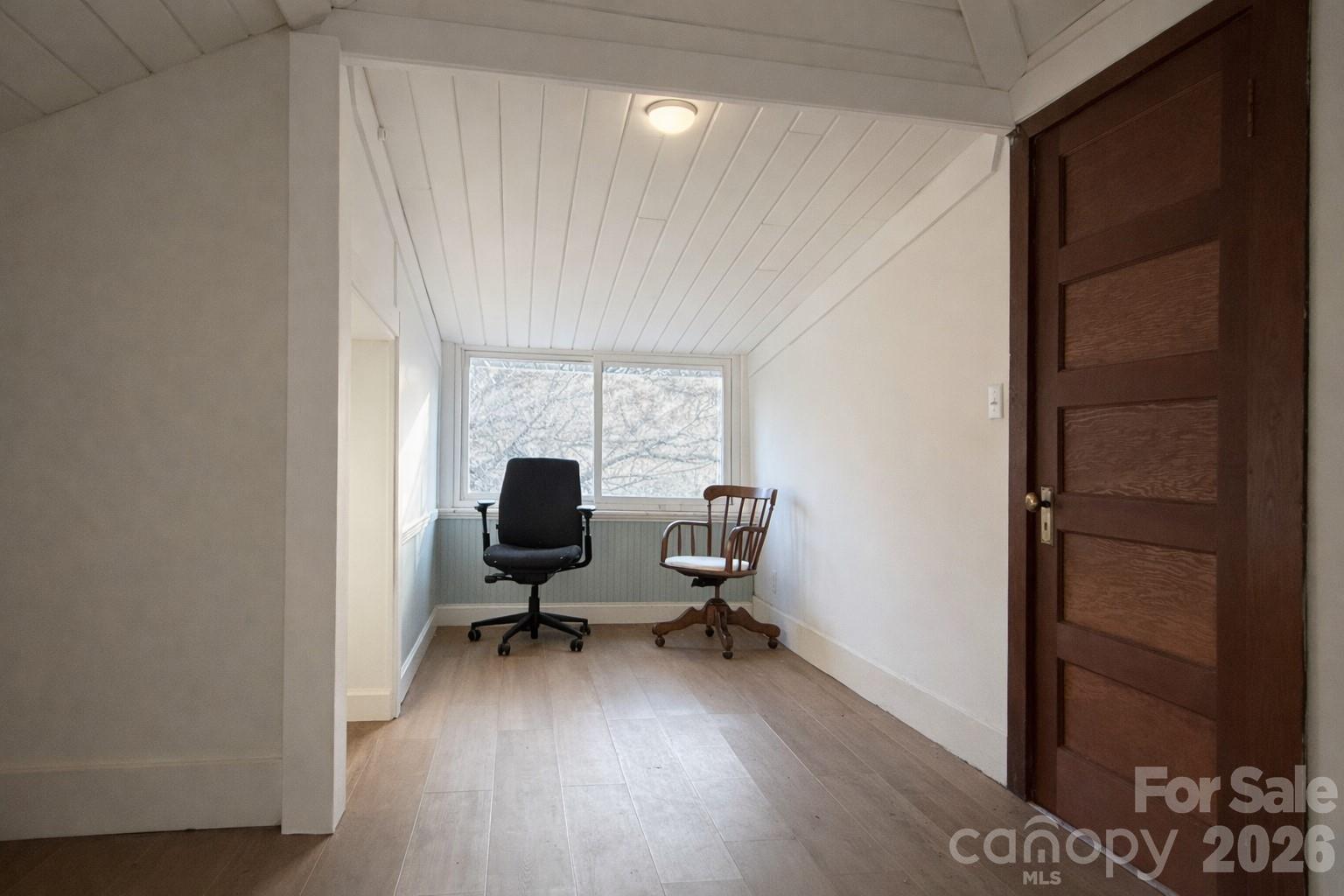129 11th Street Spencer, NC 28159 - Photo 15 of 22 a view of a workspace with furniture and a window