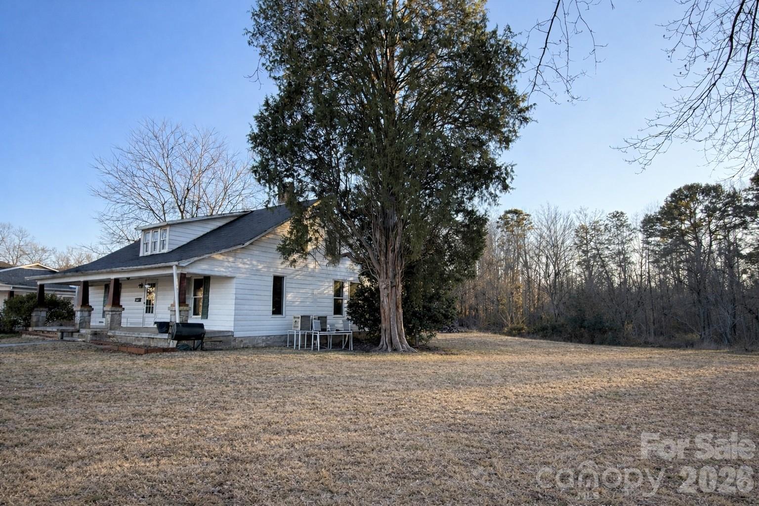 129 11th Street Spencer, NC 28159 - Photo 2 of 22 a front view of a house with a yard