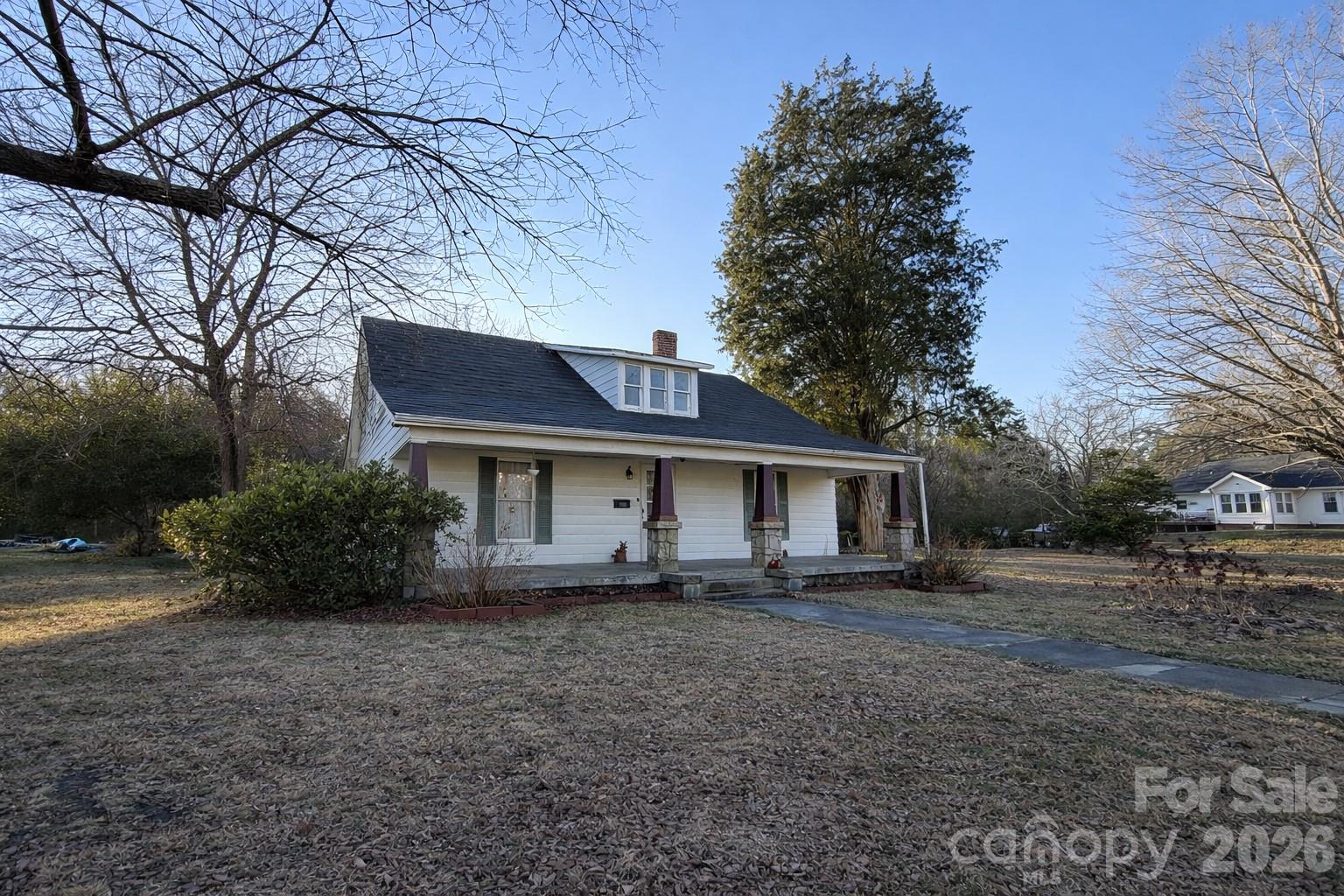 129 11th Street Spencer, NC 28159 - Photo 22 of 22 a house that has a tree in front of it