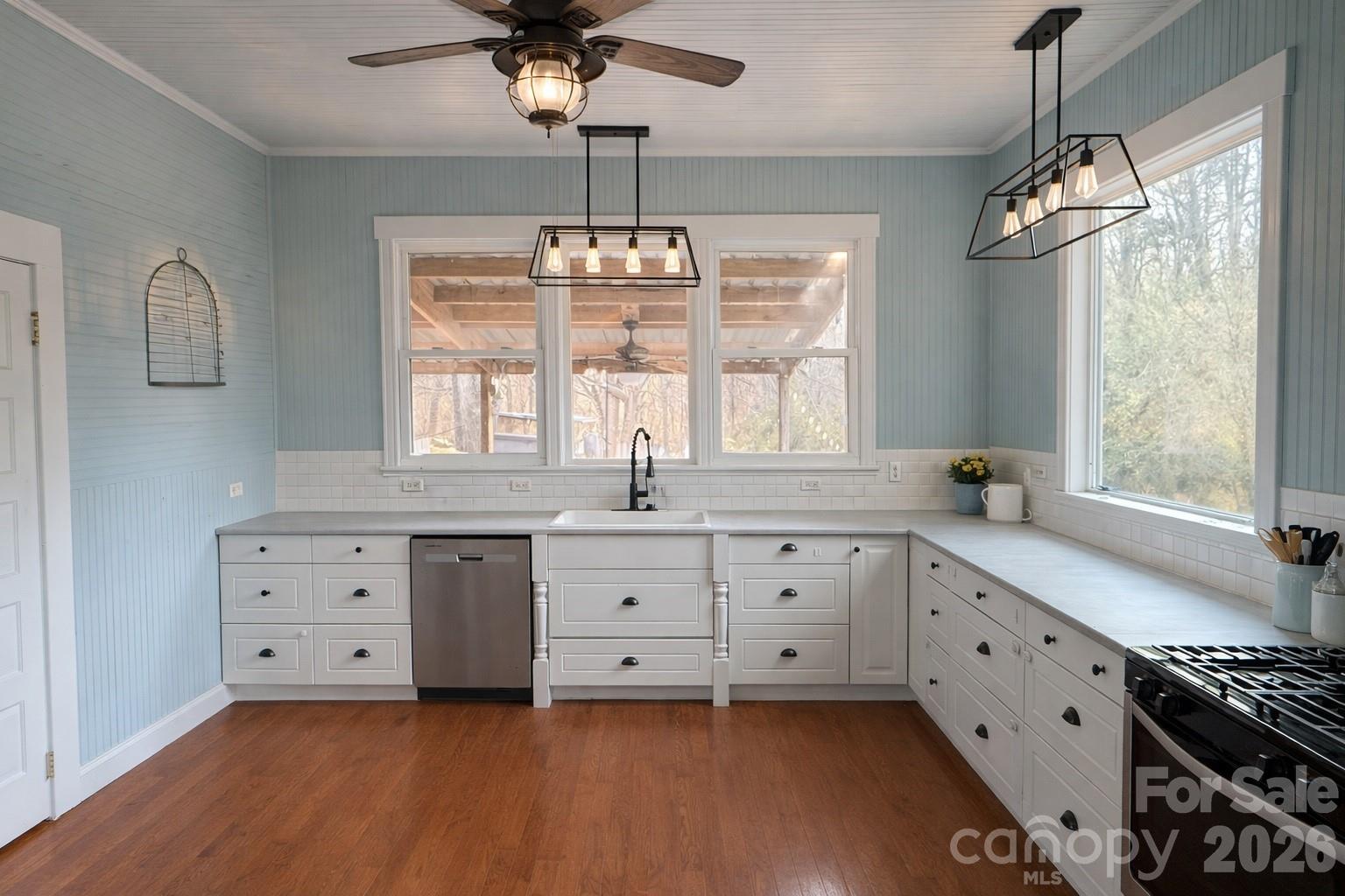 129 11th Street Spencer, NC 28159 - Photo 3 of 22 a spacious white kitchen with a large window