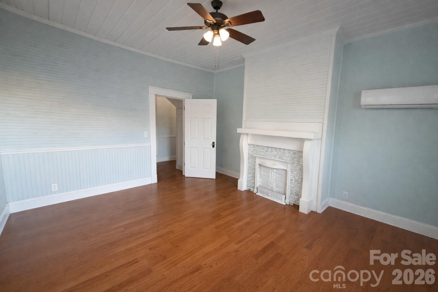 129 11th Street Spencer, NC 28159 - Photo 10 of 22 a view of empty room with wooden floor and fan
