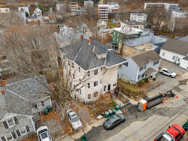 an aerial view of a houses with outdoor space
