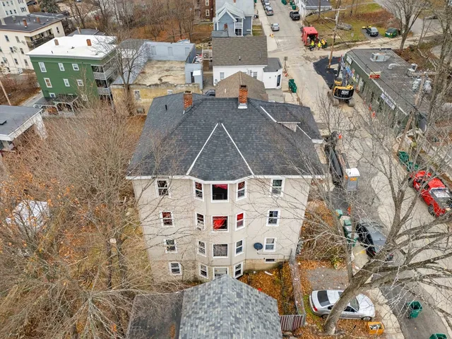 an aerial view of residential houses with outdoor space
