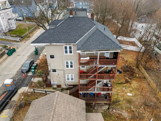 a view of a house with a yard and balcony