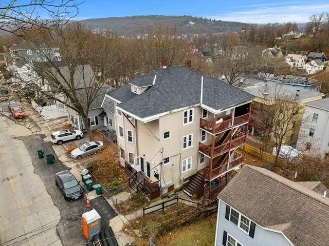 an aerial view of residential houses with outdoor space