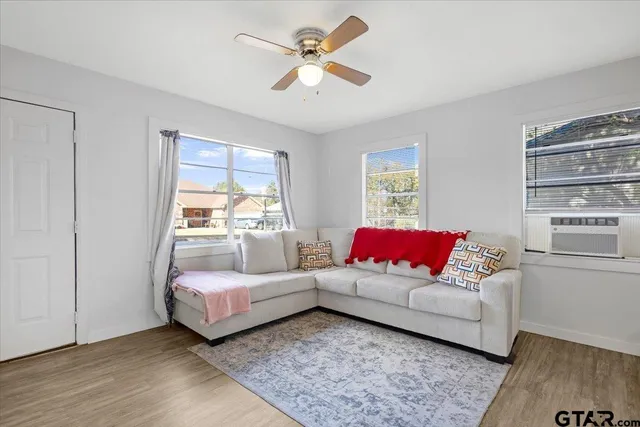 a living room with furniture and a large window