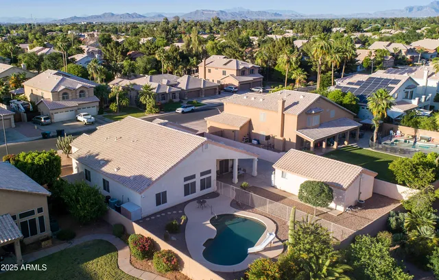 an aerial view of residential houses with outdoor space