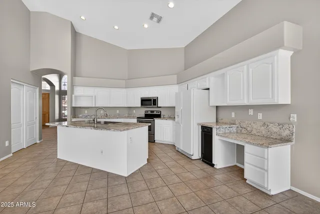 a kitchen with a sink and cabinets