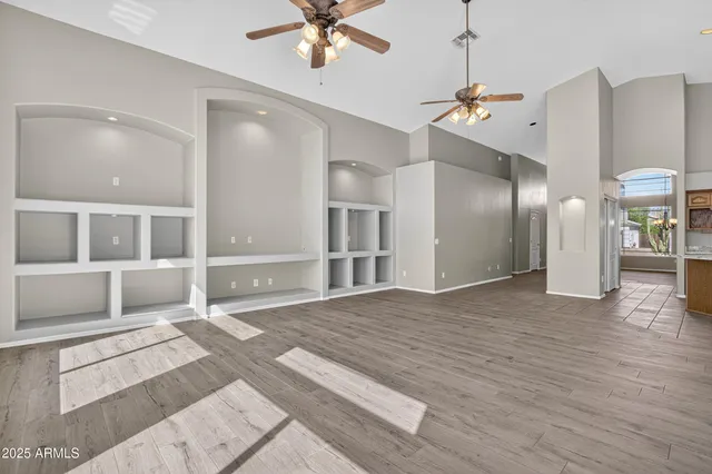 a view of an entryway with wooden floor