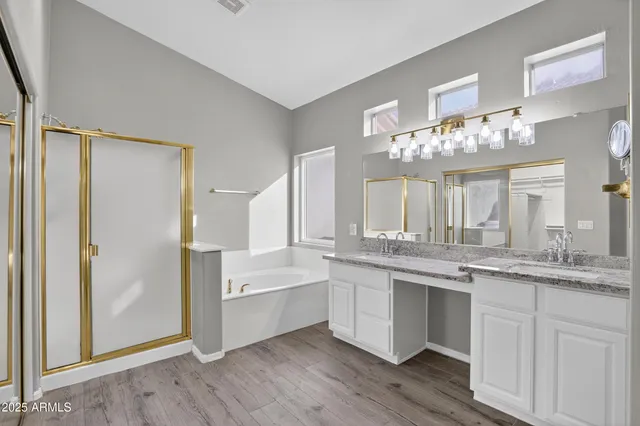 a large white kitchen with a sink and dish washer