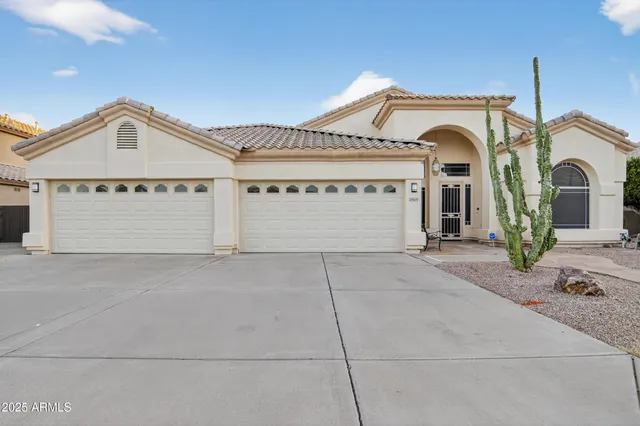 a front view of a house with garage