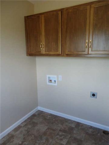 293 Williams Road Lafayette, TN 37083 - Photo 4 of 10 Utility room with useful cabinets