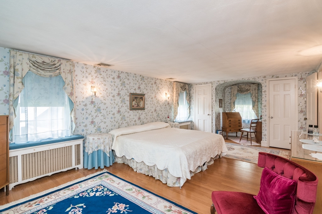 32 Longview Drive Longmeadow, MA 01106 - Photo 23 of 42 a bedroom with a bed and wooden floor