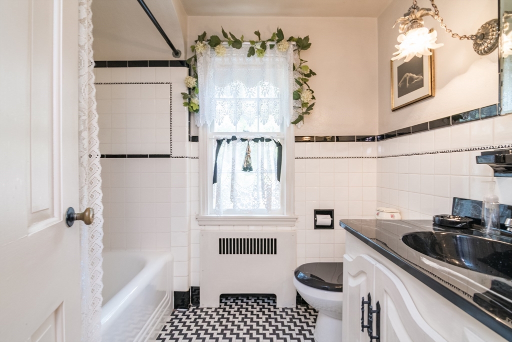 32 Longview Drive Longmeadow, MA 01106 - Photo 25 of 42 a bathroom with a granite countertop sink a refrigerator and a shower
