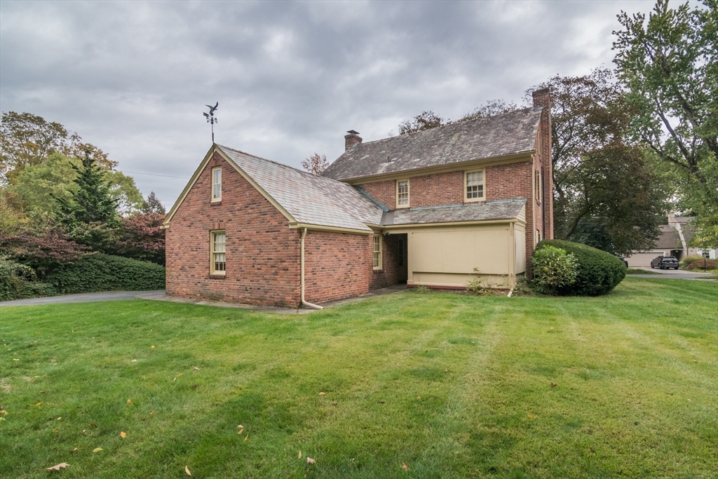 32 Longview Drive Longmeadow, MA 01106 - Photo 37 of 42 a front view of a house with a yard and garage