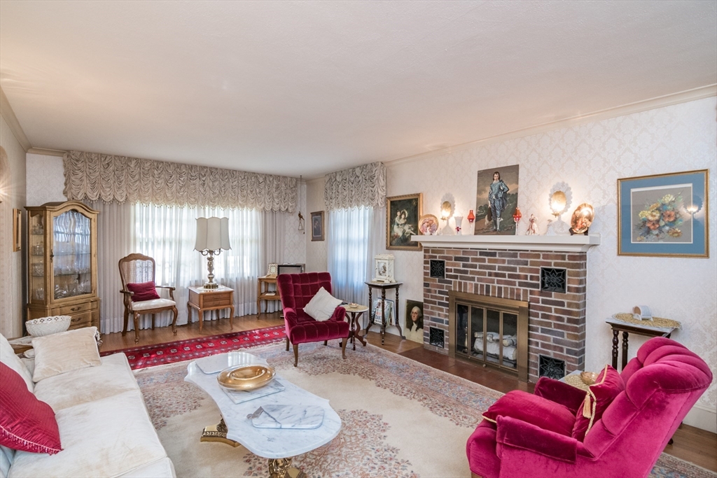 32 Longview Drive Longmeadow, MA 01106 - Photo 7 of 42 a living room with furniture a fireplace and a large window