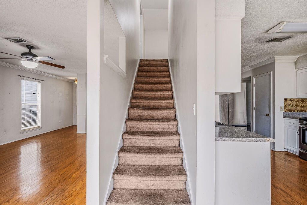 53 4th Street Shalimar, FL 32579 - Photo 18 of 47 a view of entryway and hall with wooden floor