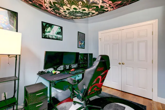 a view of an entryway with wooden floor