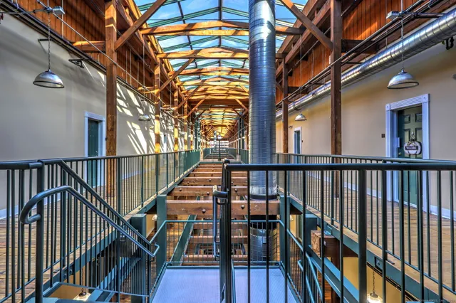 a balcony with wooden floor and stairs