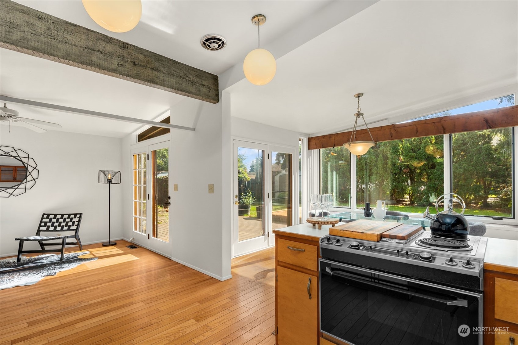15040 131st Avenue Southeast Renton, WA 98058 - Photo 11 of 39 a kitchen with a sink and living room view