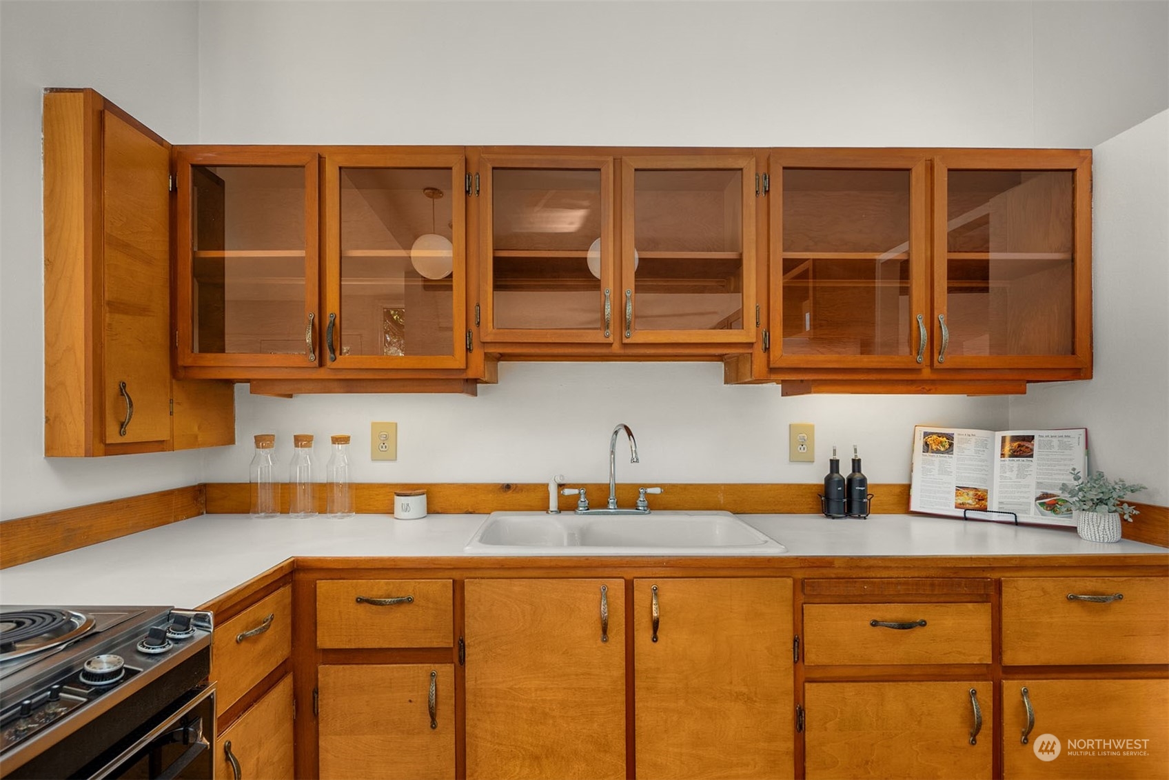 15040 131st Avenue Southeast Renton, WA 98058 - Photo 12 of 39 a kitchen with stainless steel appliances granite countertop a sink stove and cabinets
