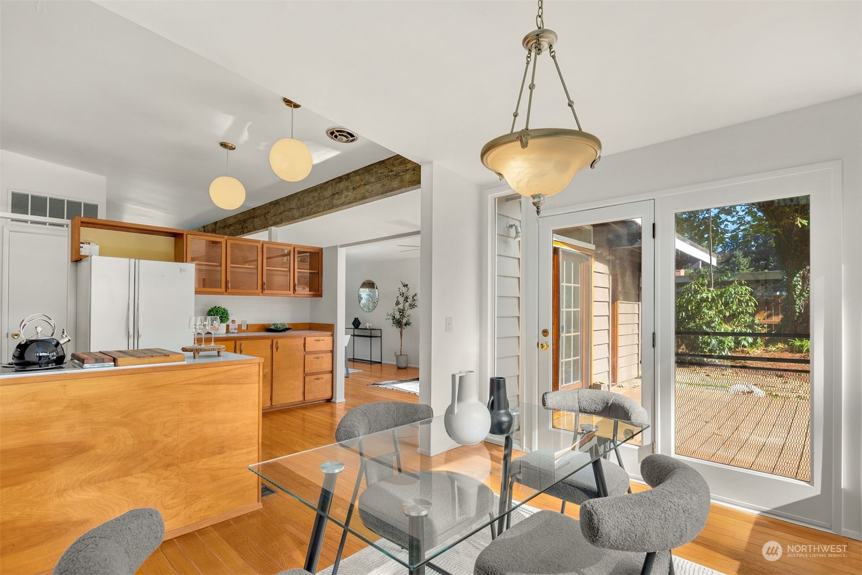 15040 131st Avenue Southeast Renton, WA 98058 - Photo 17 of 39 a dining room with furniture and a chandelier