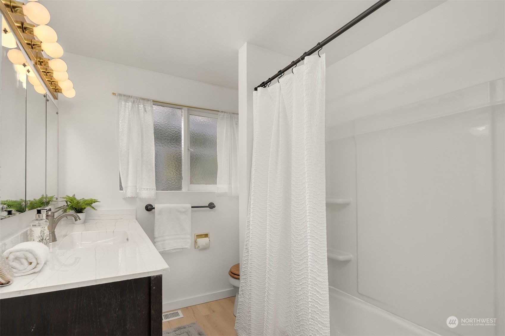 15040 131st Avenue Southeast Renton, WA 98058 - Photo 18 of 39 a bathroom with a sink and a mirror