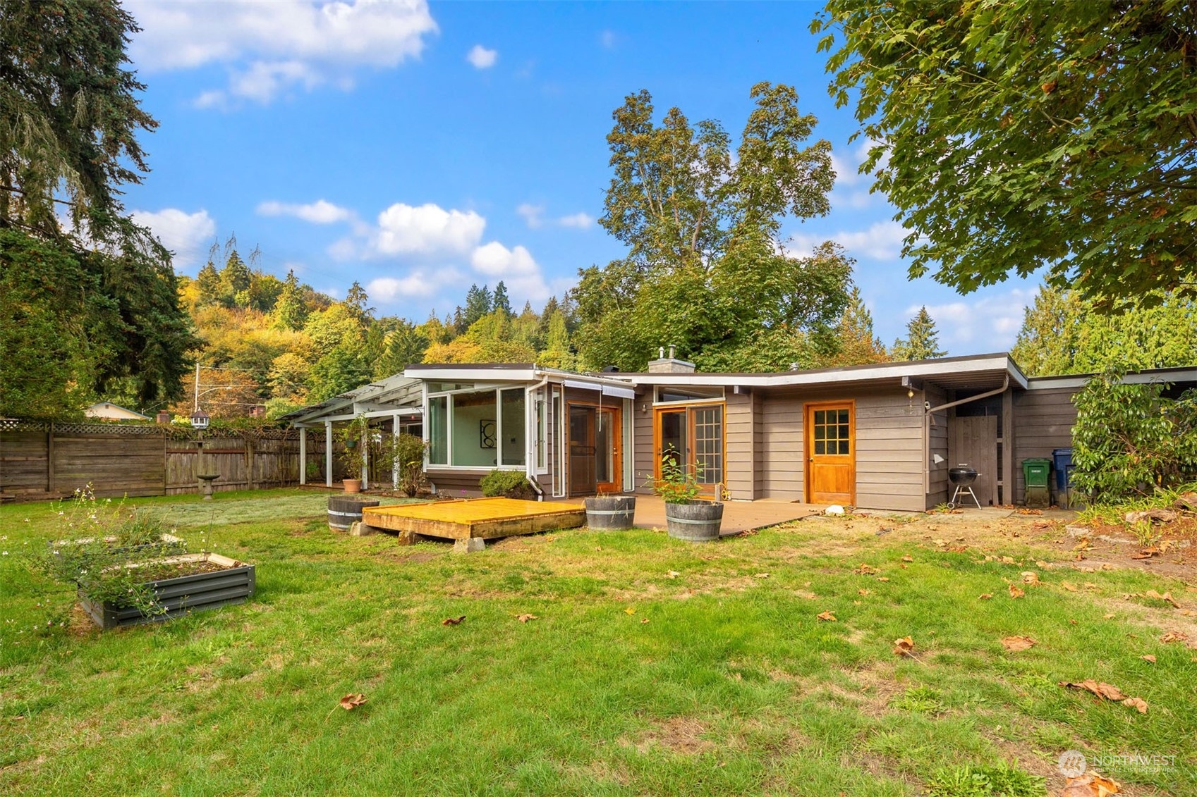 15040 131st Avenue Southeast Renton, WA 98058 - Photo 27 of 39 a front view of a house with a yard table and chairs