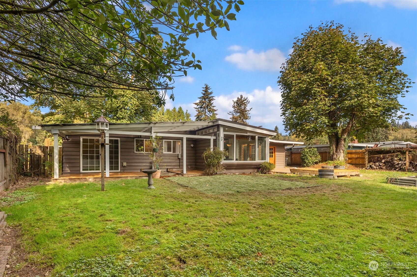 15040 131st Avenue Southeast Renton, WA 98058 - Photo 28 of 39 a view of a house with a yard porch and sitting area