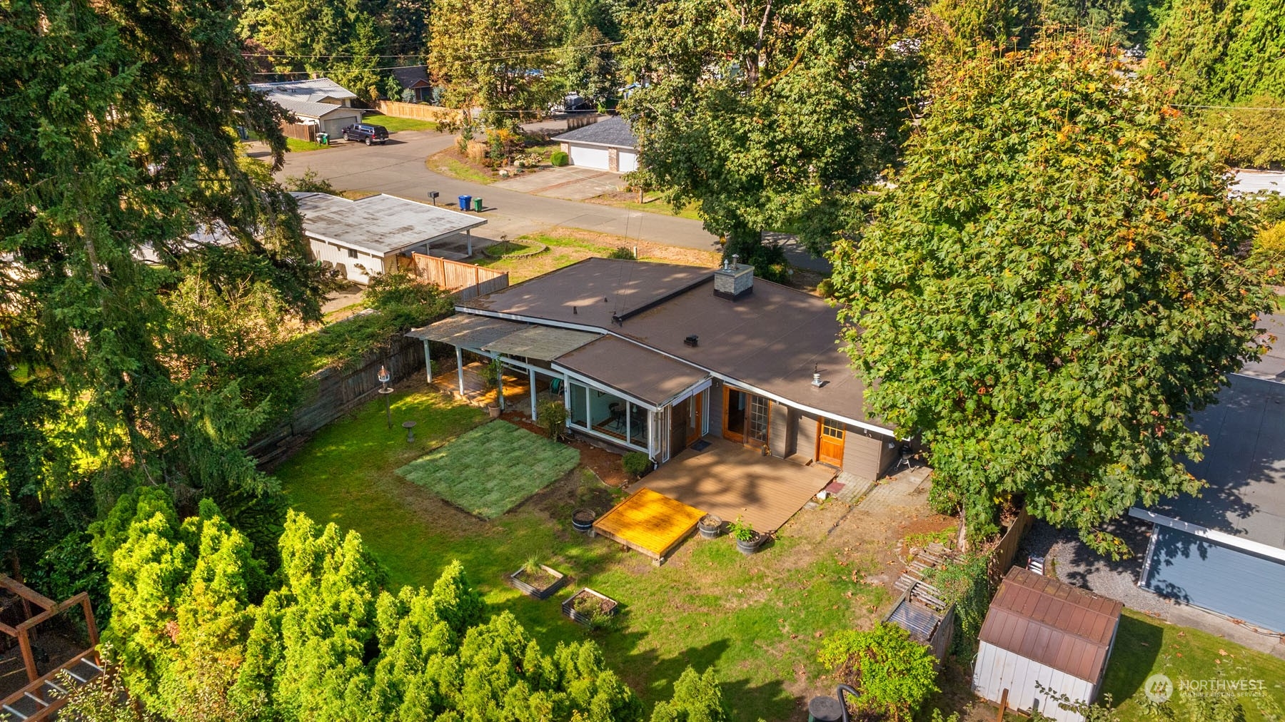 15040 131st Avenue Southeast Renton, WA 98058 - Photo 34 of 39 an aerial view of a house with swimming pool and large trees