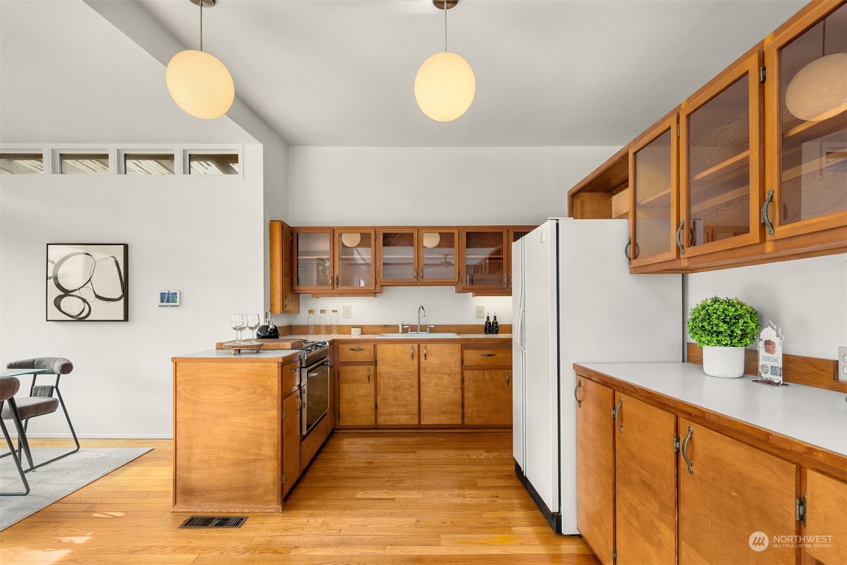 15040 131st Avenue Southeast Renton, WA 98058 - Photo 8 of 39 a kitchen with stainless steel appliances granite countertop a stove a sink and a refrigerator