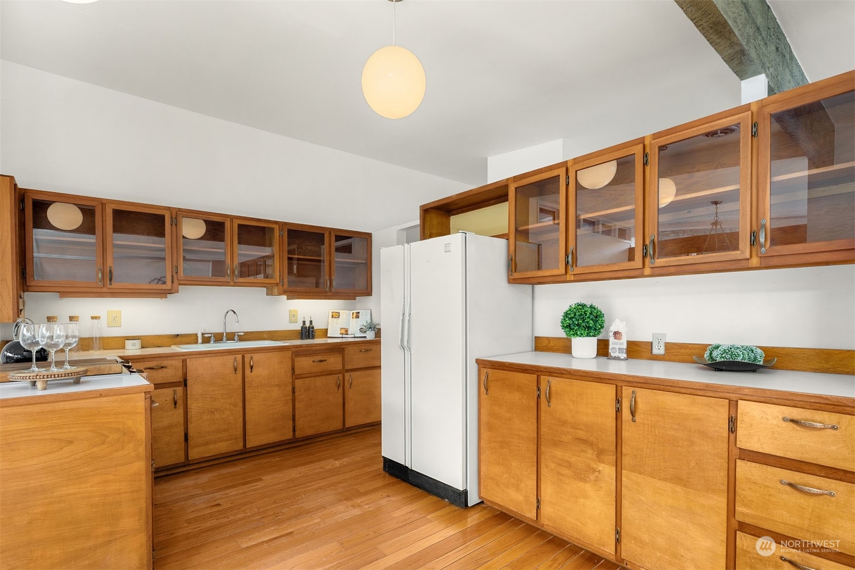 15040 131st Avenue Southeast Renton, WA 98058 - Photo 9 of 39 a kitchen with stainless steel appliances granite countertop a sink and a refrigerator
