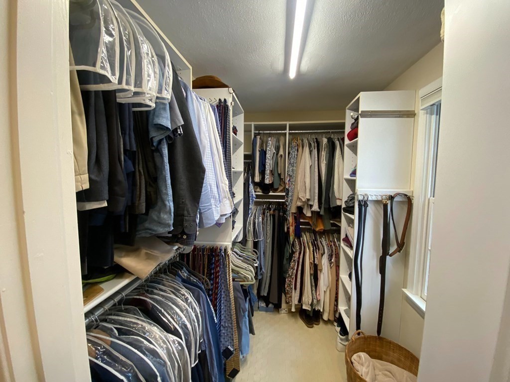 126 Maynard Farm Road Sudbury, MA 01776 - Photo 17 of 32 a view of walk in closet with clothes
