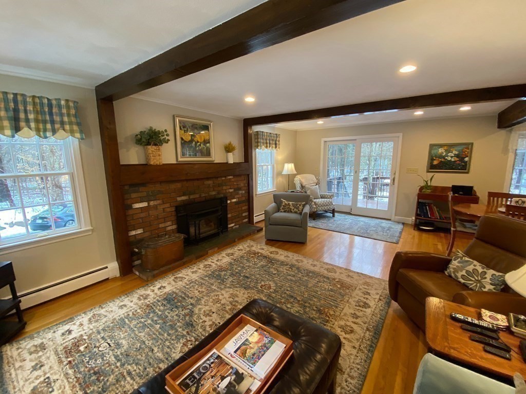126 Maynard Farm Road Sudbury, MA 01776 - Photo 5 of 32 a living room with furniture and a fireplace
