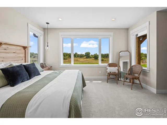 a bathroom with a double vanity sink a mirror and a bathtub