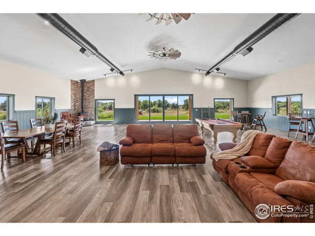 a spacious bedroom with a bed and a couch