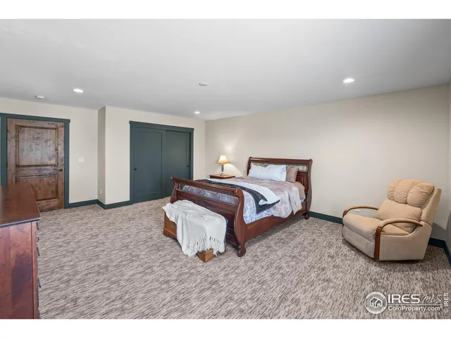 a bathroom with a sink a toilet a mirror and bathtub