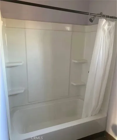 a view of a patio with table and chairs potted plants with wooden floor
